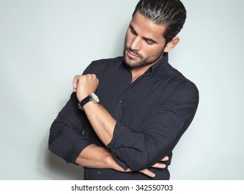 Handsome Young Man In Black Dress Shirt Wearing A Wristwatch 