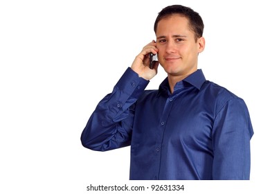 Handsome young man in a blue shirt talking on his smartphone