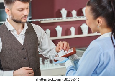 Handsome Young Man Buying Jewelry At The Local Jewelry Store