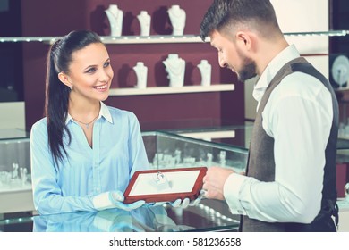 Handsome Young Man Buying Jewelry At The Local Jewelry Store