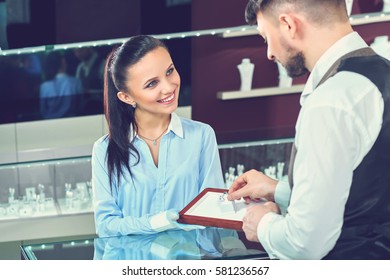 Handsome Young Man Buying Jewelry At The Local Jewelry Store