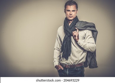 Handsome Young Man In Casual Jacket And Neck Scarf