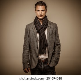 Handsome Young Man In Casual Jacket And Neck Scarf