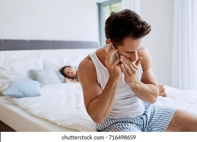 Handsome Young Man Cheating On Girlfriend Talking With Lover While She Is Sleeping In The Background