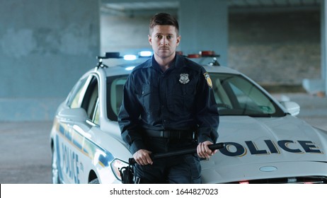 Handsome Young Man Cops Stand Near Patrol Car Look At Camera Around Enforcement Background His Colleague Happy Officer Police Uniform Auto Safety Control Policeman Portrait Close Up Slow Motion