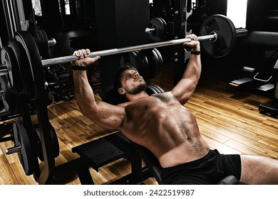 handsome young man doing bench press workout in gym, Fitness motivation, sports lifestyle, health, athletic body, body positive. Film grain, selective focus - Powered by Shutterstock