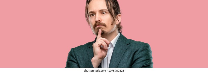 Handsome young man doubt expression, confuse and wonder concept, uncertain future