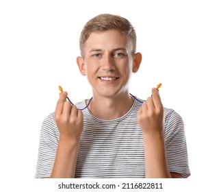 Handsome Young Man With Earplugs On White Background