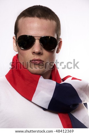 Handsome young man English wearing flag scarf