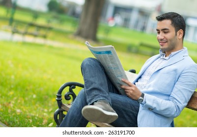 Handsome Young Man Enjoying And Reading Newspapers, Outdoor - Outside