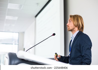 Handsome Young Man Giving A Speech At A Conference