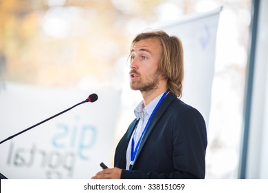 Handsome Young Man Giving A Speech At A Conference