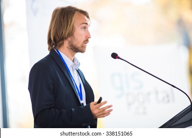 Handsome Young Man Giving A Speech At A Conference