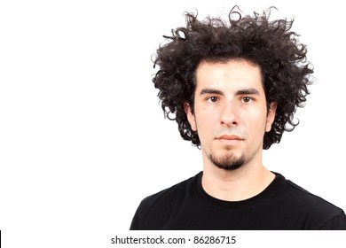 Handsome young man with goatee and long curly hair.