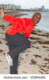 Handsome Young Man With A Heisman Trophy Pose Enjoying South Beach In Miami.