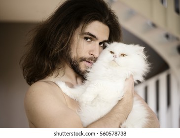 Handsome Young Man Holding A Cat