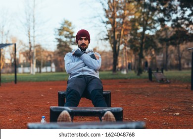 Handsome Young Man Jogging Outdoors In City Park Work Out In Outdoor Gym