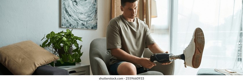 Handsome young man makes adjustments to his prosthetic leg in a modern living space. - Powered by Shutterstock