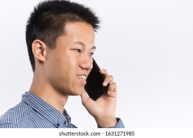 Handsome Young Man Making A Phone Call, Isolated On White Background