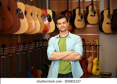 Handsome Young Man In Music Store