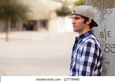 Handsome young man outdoors in a downtown urban setting. - Powered by Shutterstock