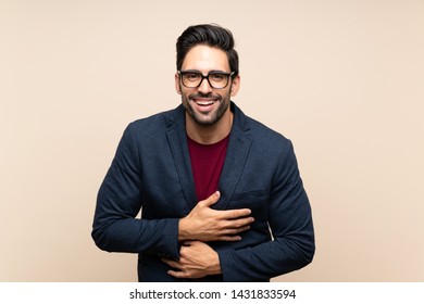 Handsome young man over isolated background smiling a lot
