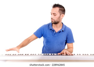 Handsome Young Man Playing The Piano Isolated In White Background