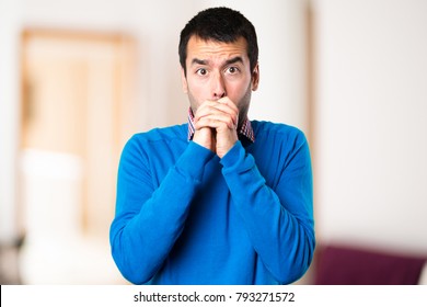 Handsome Young Man Pleading On Unfocused Background