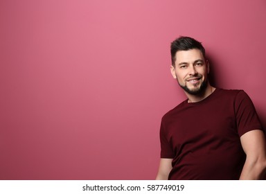 Handsome Young Man Posing On Color Background