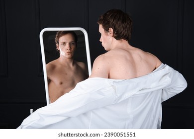Handsome young man posing in the studio.