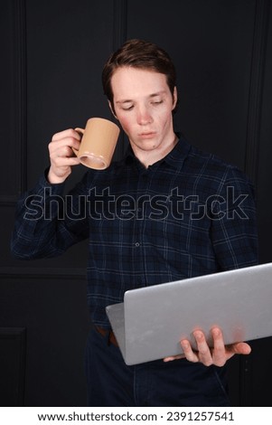 Handsome young man posing in the studio. Study and work.
