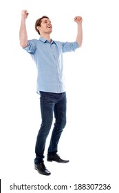 Handsome Young Man Raising His Arms In Excitement