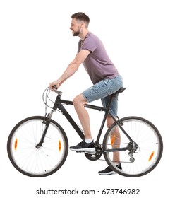 Handsome Young Man Riding Bicycle On White Background