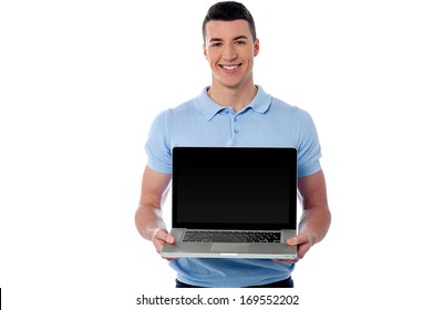 Handsome Young Man Showing His New Laptop