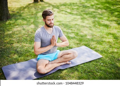 Young Man Meditating Outdoors Park Sitting Stock Photo 1048448299 ...