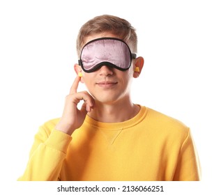 Handsome Young Man With Sleeping Mask And Earplugs On White Background