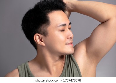 Handsome Young Man Smelling His Armpit After Shower