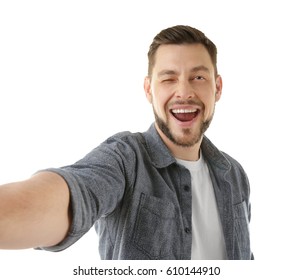 Handsome Young Man Taking Selfie On White Background