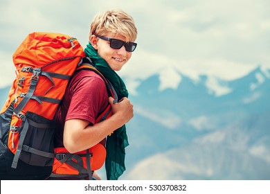 Handsome young man tourist backpacker portrait on Himalaya mountain view