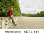 handsome young man using tablet computer. student with a backpack