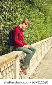 handsome young man using tablet computer. student with a backpack