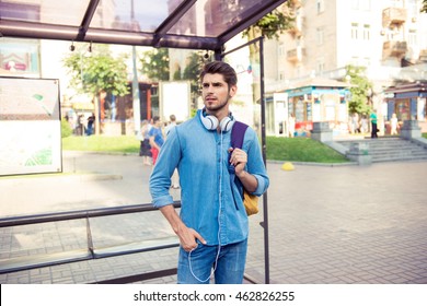 Handsome Young Man  Waiting His Bus At Bus Stop