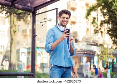 Handsome Young Man  Waiting His Bus And Smiling