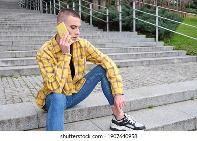 Handsome young man wearing make up, talking on his smartphone upset. Non binary androgynous guy. - Powered by Shutterstock