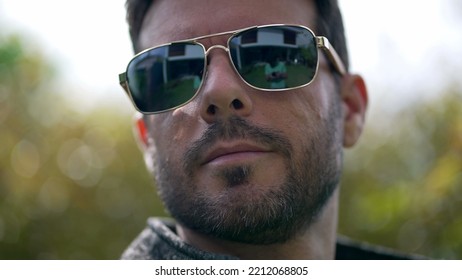 Handsome Young Man Wearing Sunglasses Outdoors. Closeup Face Of Male Person With Eye Glass