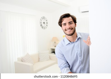 Handsome Young Man Welcome Friends At Open Front Door New Student Home Apartment 