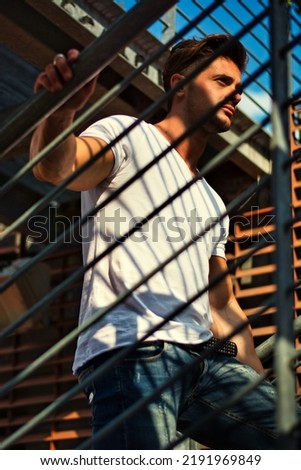 Similar – black haired man posing with sunglasses