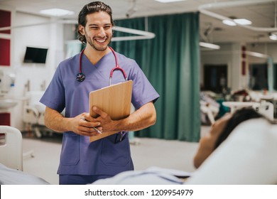 Handsome young physician at a hospital - Powered by Shutterstock