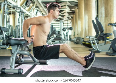 Handsome Young Shirtless Guy Doing Bench Dips Exercises At Gym