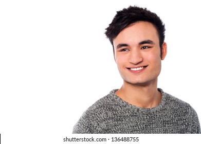 Handsome young smiling man isolated over white background.